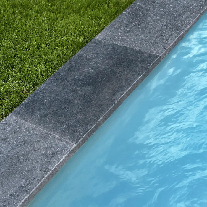 Poolumrandung aus Granit Silversand mit Poolrandplatten aus Blaustein in Saarbrücken