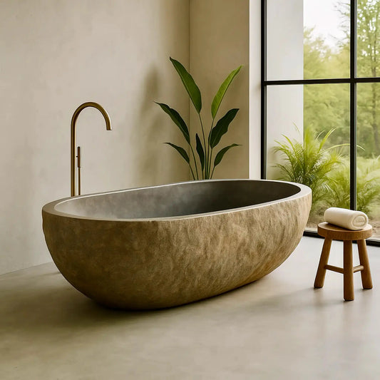Baignoire en pierre naturelle, sculptée dans un galet. Intérieur gris brillant, extérieur brut. Apporte du caractère à votre salle de bain moderne et zen.